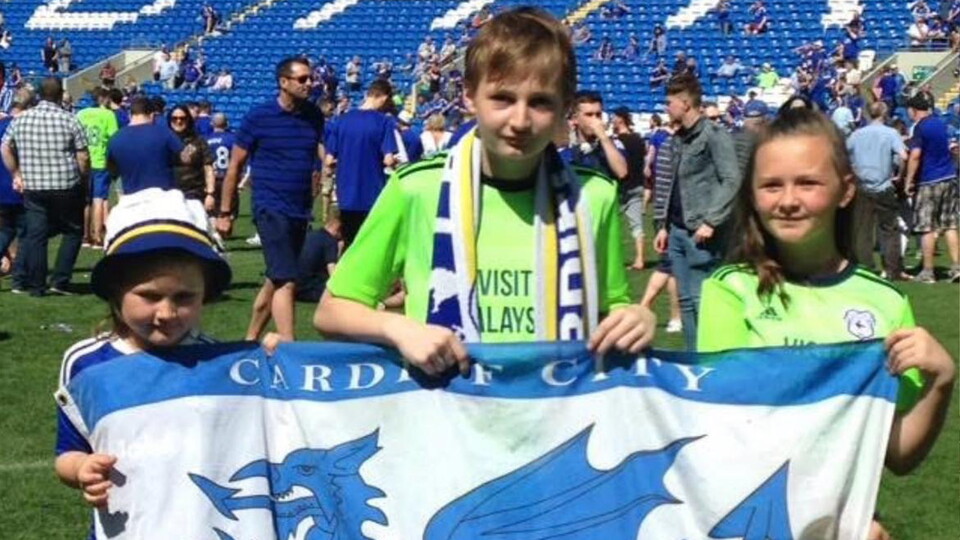 City supporters on the pitch at CCS celebrating promotion in 2018.