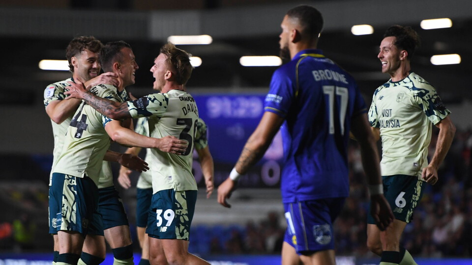 Isaak Davies celebrates with his teammates at AFC Wimbledon...