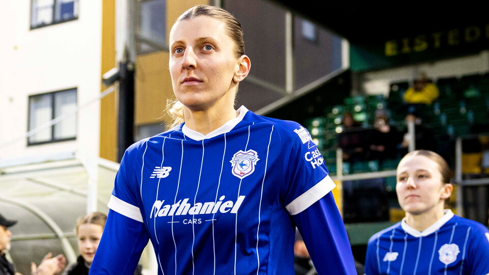 Shannon Evans walks out to represent Cardiff City at a match.