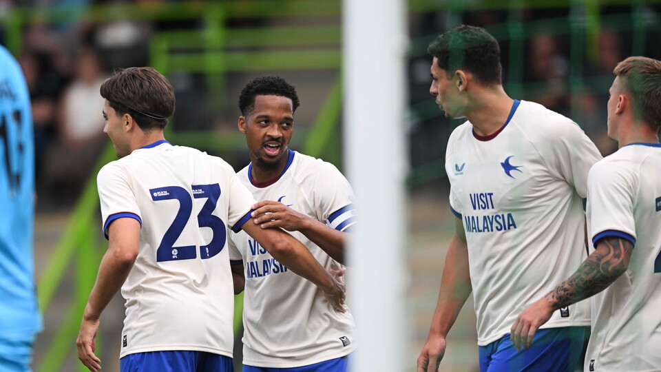Chris Willock celebrates his goal with Joel Colwill and Yousef Salech.