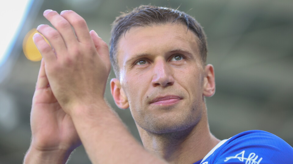 Krystian Bielik applauds the Bluebirds support at Cardiff City Stadium.