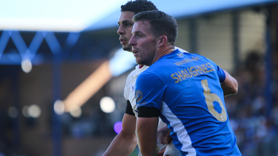 Yousef Salech competes for the ball with Portsmouth’s Conor Shaughnessy.